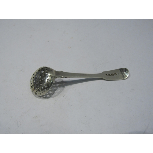 4361 - A Georgian silver sifter spoon with engraved crest to handle, London 1821, length approximately 10cm