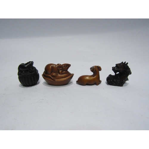 4368 - Four boxwood netsuke, Dragon, Rat on a basket, Rat on a gourd and Ram, some signed