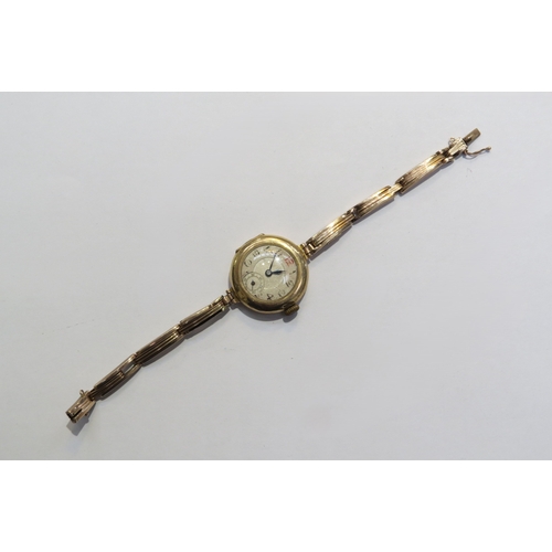 8128 - A 9ct gold ladies wristwatch with gold flexible sprung strap swiss movement