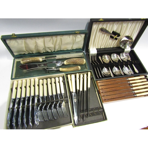 4395 - A quantity of flatware to include a horn handle carving set, boxed