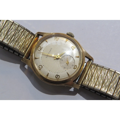 8110 - A Garrad retailed 9ct gold cased gents manual wind wristwatch. Presentation inscription to back on b... 