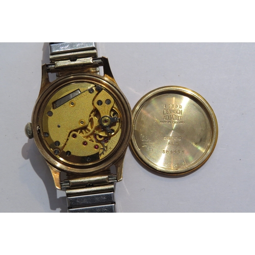 8110 - A Garrad retailed 9ct gold cased gents manual wind wristwatch. Presentation inscription to back on b... 