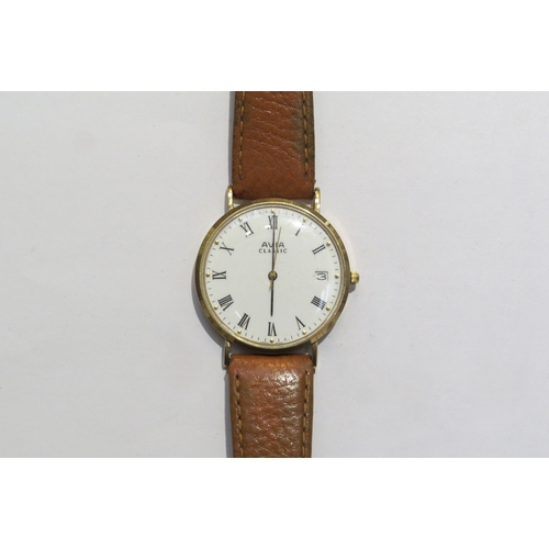 8106 - A gents Avia Classic 9ct gold watch with leather strap