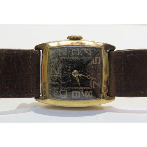 8112 - A vintage Omega 9ct gold cased manual wind wristwatch, second hand missing, strap may need replacing