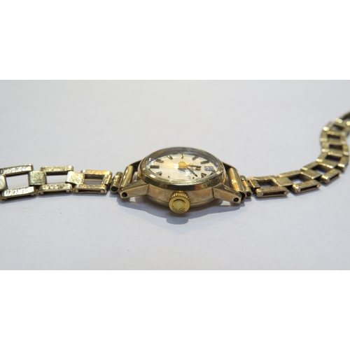 8184 - A 9ct gold cased ladies Omega with gold strap along with a rolled gold ladies Tissot Stylist, in Ome... 