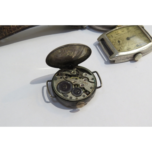 8155 - A group of four silver watches inclduing a J. W. Benson, London with subsidiary seconds dial on leat... 