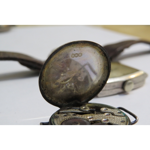 8155 - A group of four silver watches inclduing a J. W. Benson, London with subsidiary seconds dial on leat... 