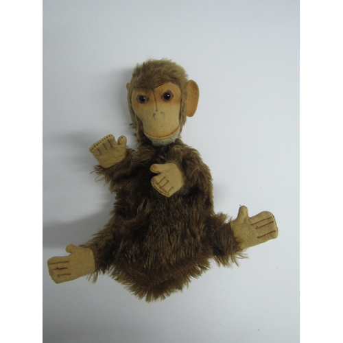 7138 - A vintage brown plush monkey glove puppet with felt face, hands and feet, 20cm tall