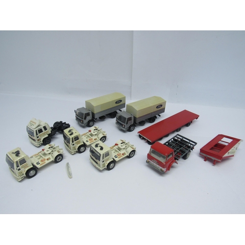 7241 - A collection of unboxed diecast commercial vehicles to include two NZG Modelle 1:50 scale Ford Cargo... 