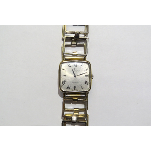 8156 - An Omega Geneve stainless steel backed wristwatch with open rectangular panel strap mannual wind