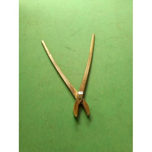 7078 - A pair of wooden weeding tongs stamped TW