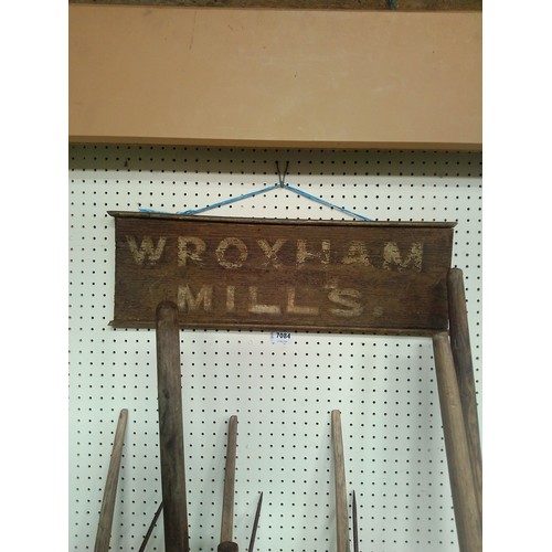 7084 - A wooden hand painted sign, Wroxham Mills, 56cm x 18cm