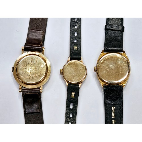 8116 - Three 9ct gold cased wristwatches, each on a leather strap. Includes a Gudux 17 Jewel Incabloc, Avia... 