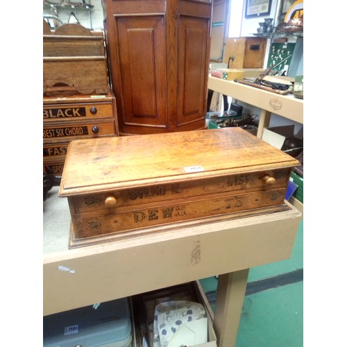 7604 - A Dewhurst's two drawer cotton cabinet    (R)  £150