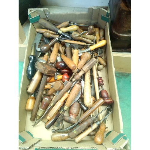 7586 - A box of wooden handled tools including chisel, punches etc