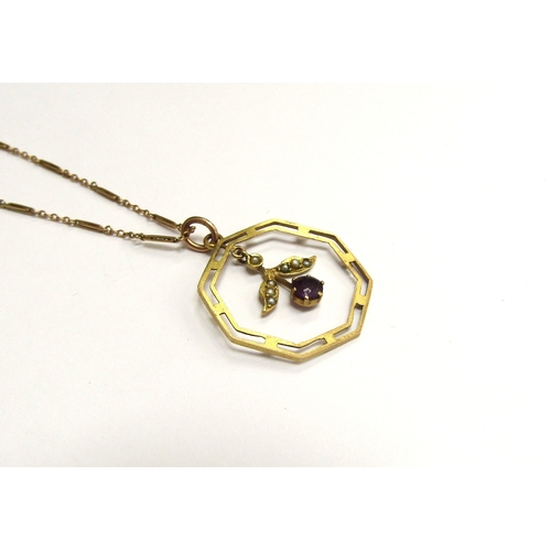 9104 - An Edwardian gold, octagonal shaped pendant with droplet stamped 9ct hung on a gold chain stamped 9c... 