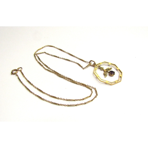 9104 - An Edwardian gold, octagonal shaped pendant with droplet stamped 9ct hung on a gold chain stamped 9c... 