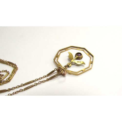 9104 - An Edwardian gold, octagonal shaped pendant with droplet stamped 9ct hung on a gold chain stamped 9c... 