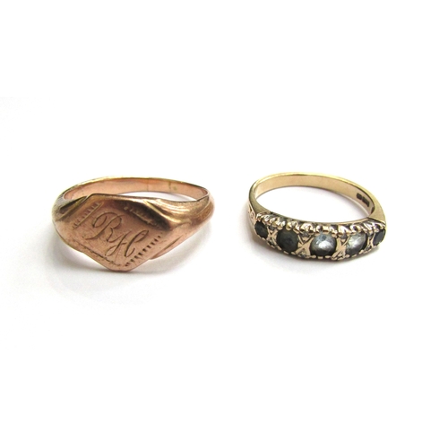 9268 - An unmarked gold signet ring, monogrammed RH, size Q and a 9ct gold ring with five pale blue stones ... 