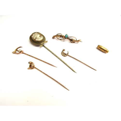 9403 - Four stick pins including 9ct gold examples, a cameo stick pin and a gold bar brooch stamped 9ct, 4.... 