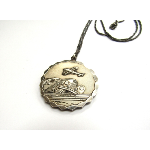 9432 - A Georg Jensen silver St Christopher pendant, 4cm diameter hung on chain         (E) £30-50