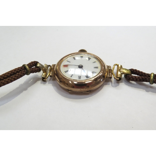 8132 - A 9ct gold cased wristwatch with white enamel dial, on leather strap   (E) £60-80 Jewellery Sale