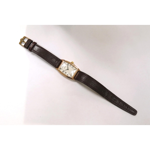 8167 - A 9ct gold cased Rolex on leather strap