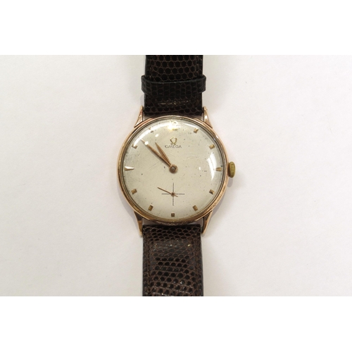 8162 - A 9ct gold omega wristwach on leather strap