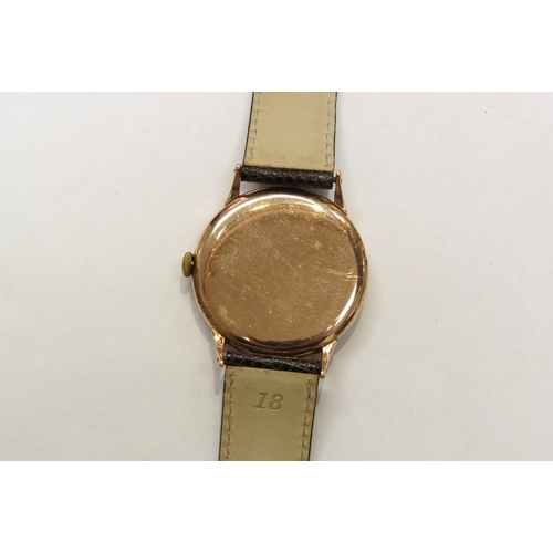 8162 - A 9ct gold omega wristwach on leather strap