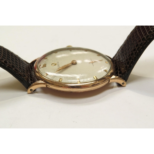 8162 - A 9ct gold omega wristwach on leather strap