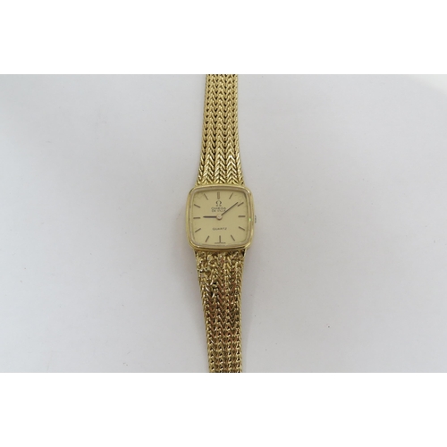 8187 - An Omega De Ville quartz 18ct gold ladies wristwatch (repair to strap)  (C)