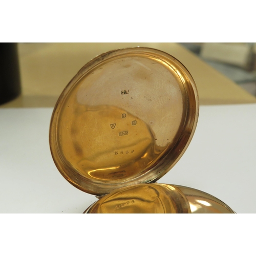 8211 - A gold cased Thos. Russell & Sons, Liverpool pocket watch, case stamped 375, with a yellow metal cha... 