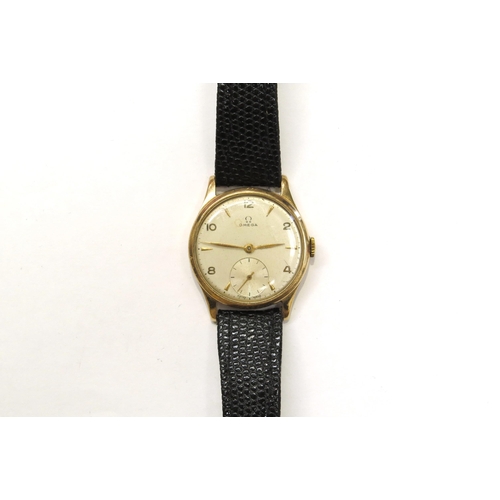 8181 - A mid 20th Century 9ct gold cased Omega gentleman's wristwatch with subsidiary seconds dial, on leat... 