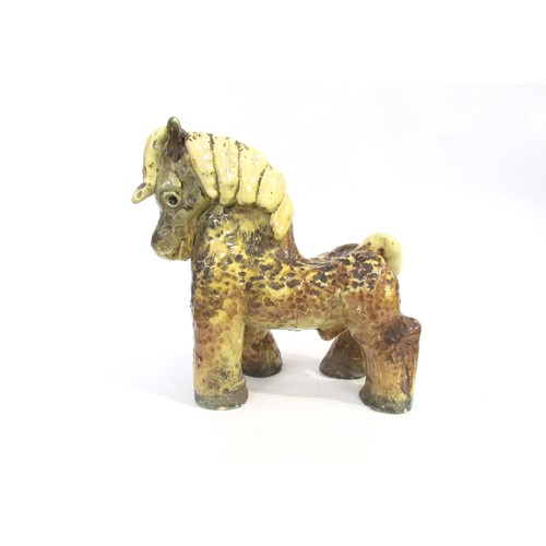 7009 - Unonius Aja for Arabia Pottery, Finland - A ceramic hand built figure of a horse c1930's, textured f... 