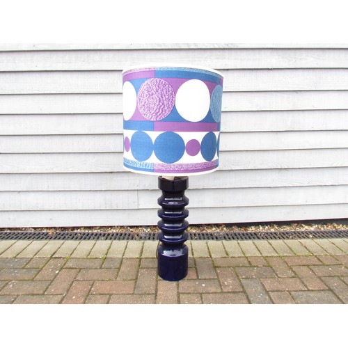 7049 - A Doulton ceramic cylindrical table lamp with deep blue glaze, op art fabric shade. 95cm high includ... 