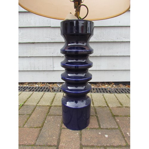 7049 - A Doulton ceramic cylindrical table lamp with deep blue glaze, op art fabric shade. 95cm high includ... 