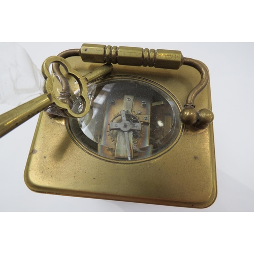 8096 - A 20th Century French brass carriage clock with white face, Roman numerals with key.  13cm tall x 8.... 