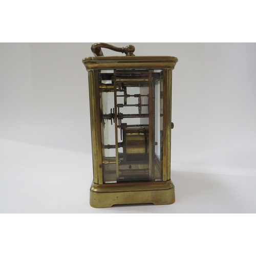 8096 - A 20th Century French brass carriage clock with white face, Roman numerals with key.  13cm tall x 8.... 