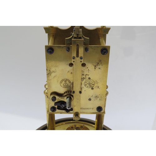 8041 - A Gustav Becker brass anniversary clock under plastic dome, 30cm tall
