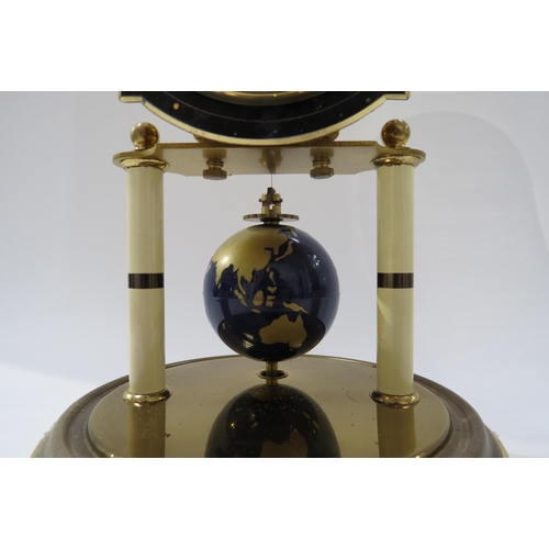 8043 - The J Kaiser Universe clock, kalset movement globe moon phase, 40 day, under glass dome