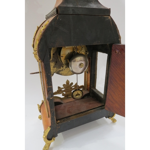 8066 - A late 19th Century French walnut and ormolu mounted striking mantel clock with ROman enamel cartouc... 