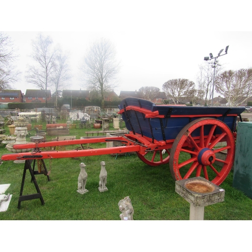 7630 - A two wheel tipping tumbril with iron name plate; W.G.Lee, Saxthorpe, wheels need attention   (R)  £... 