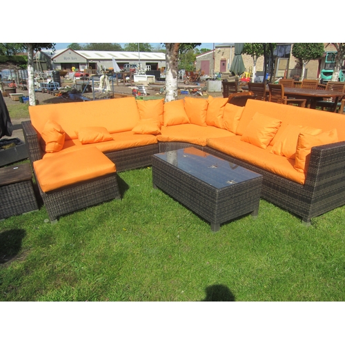 3617 - A three section wicker effect curved garden sofa with footstool, cushions and two drinks tables