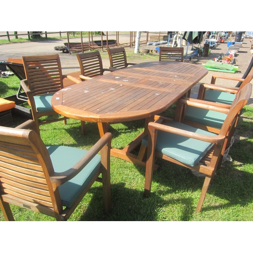 3624 - An extending teak garden table with eight chairs and cushions