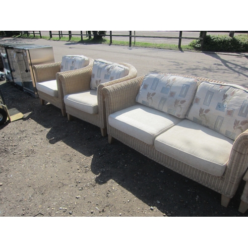 3640 - A wicker conservatory suite consisting of two seater settee, a pair of tub chairs and drinks table