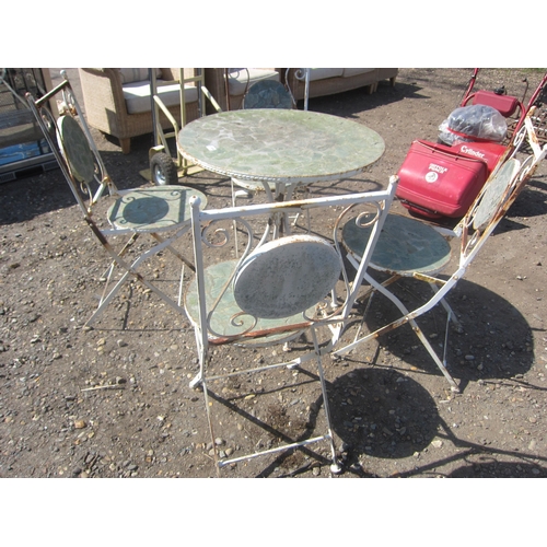 3604 - A metal and stone garden table and four chairs