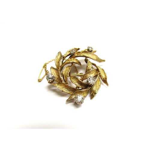 9147 - A 9ct gold leaf form brooch studded with five claw set diamonds 0.80t total approx, 9.2g   (R) £280