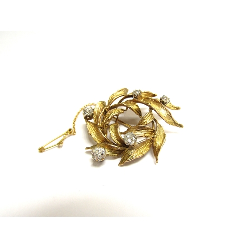 9147 - A 9ct gold leaf form brooch studded with five claw set diamonds 0.80t total approx, 9.2g   (R) £280