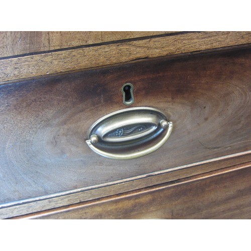 1022 - An early Victorian mahogany chest of two short over three long drawers, brass oval handles, 100cm ta... 