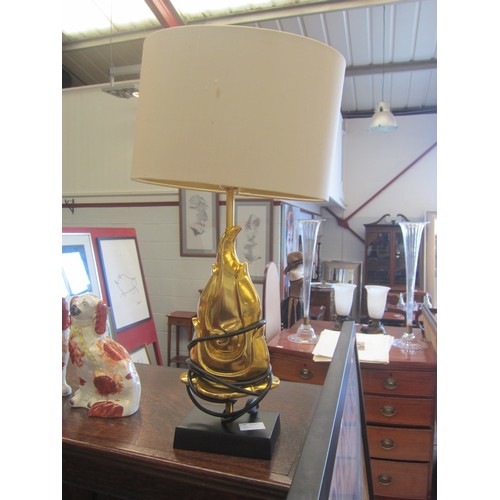 1074 - A table lamp base as a gilded flame, beige shade, 60cm tall  (E)  £20-30